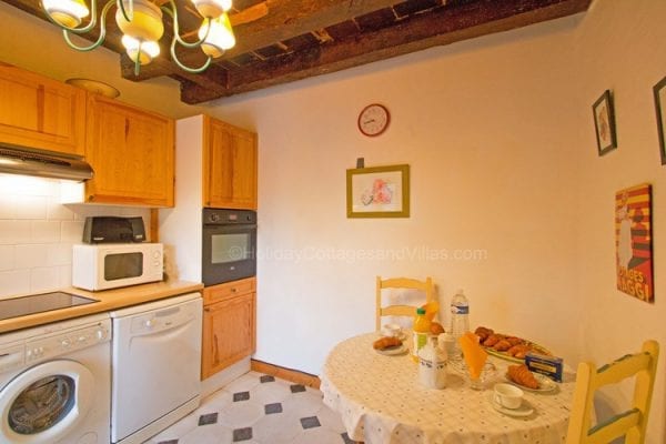 Le Moulin kitchen with breakfast table