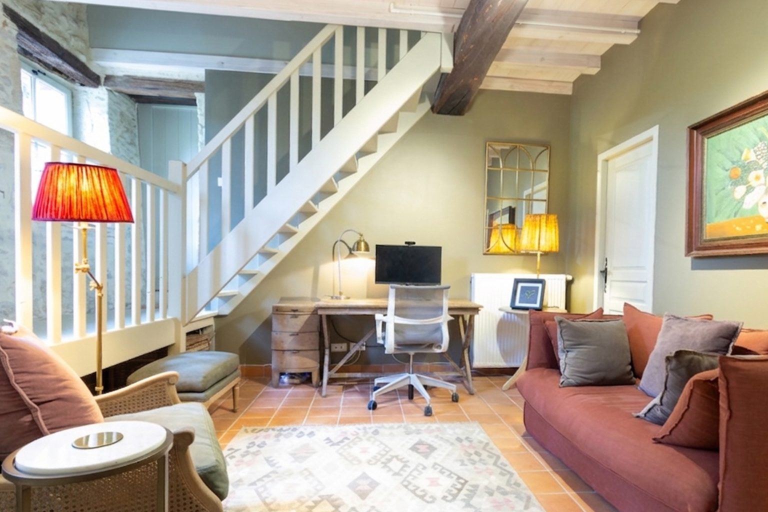 Dedicated office workspace at Blanchet holiday villa in Southwest France, featuring a wooden desk, a white Herman Miller ergonomic chair, a computer monitor, and high-speed broadband.