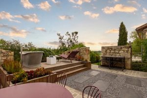 The feature exterior bath and what a view, ideal to watch the sunset at Blanchet luxury holiday home in Southwest France, overlooking the rolling valley views between Bordeaux and Bergerac