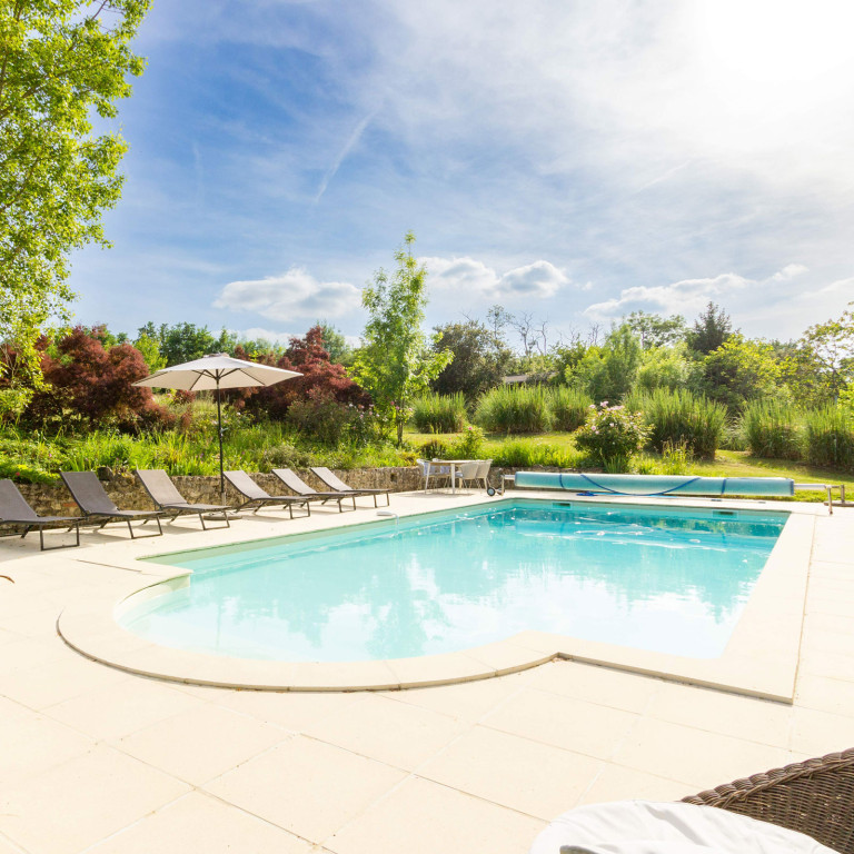 Exterior of Blanchet, a luxury holiday villa in SW France near Duras and Monségur, featuring a private heated pool and stunning Aquitaine countryside views.