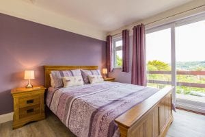Bedroom 1 with views down to Combe Martin and the beach