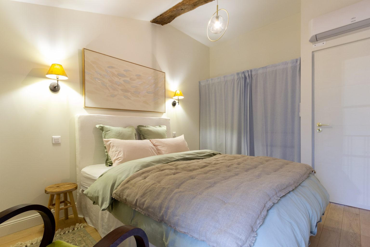 Bedroom 2, clothes hanging and drawers are behind the curtain