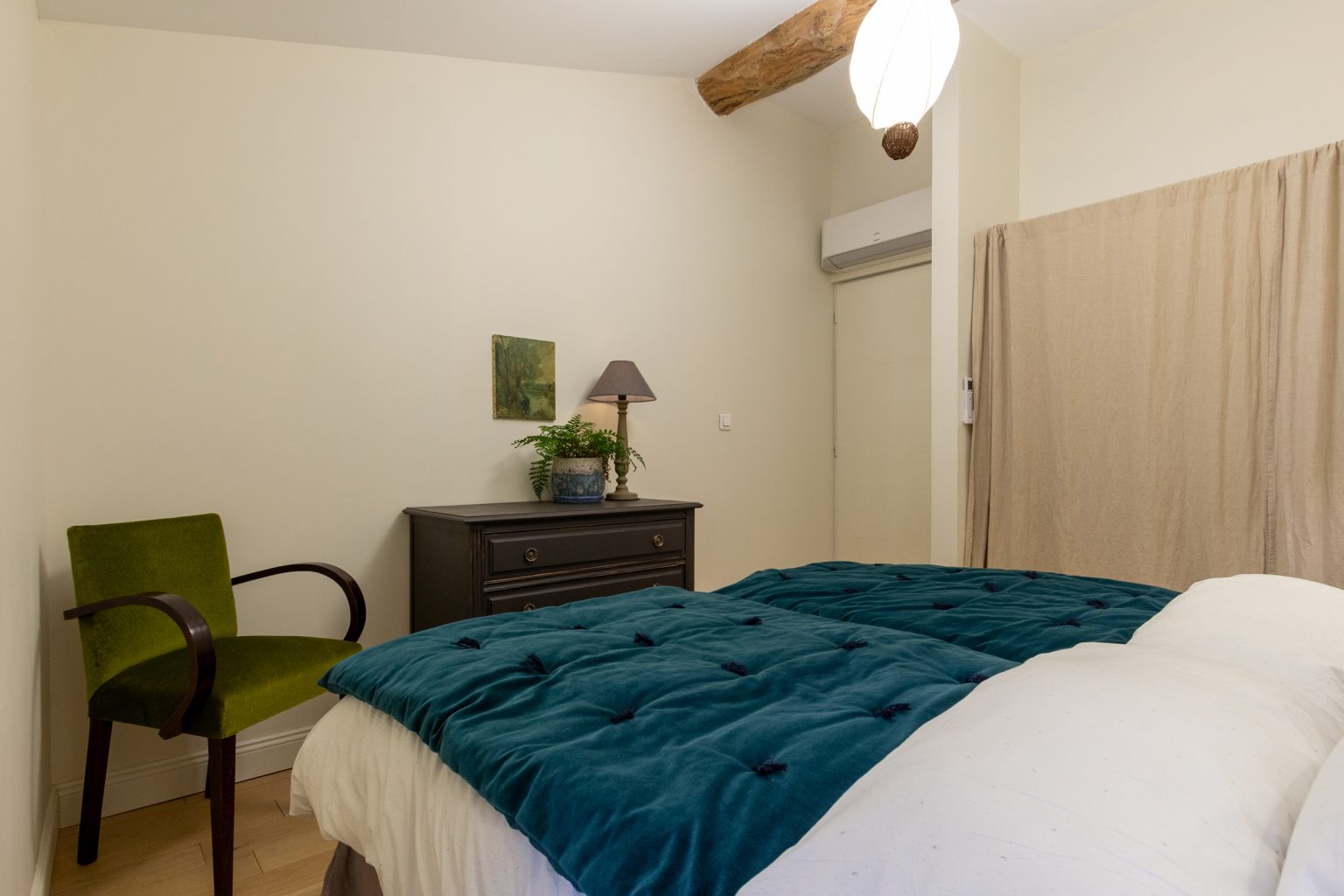 Bedroom 3, clothes hanging and drawers are behind the curtain