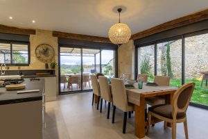 Dining table, looking out to the pool and garden