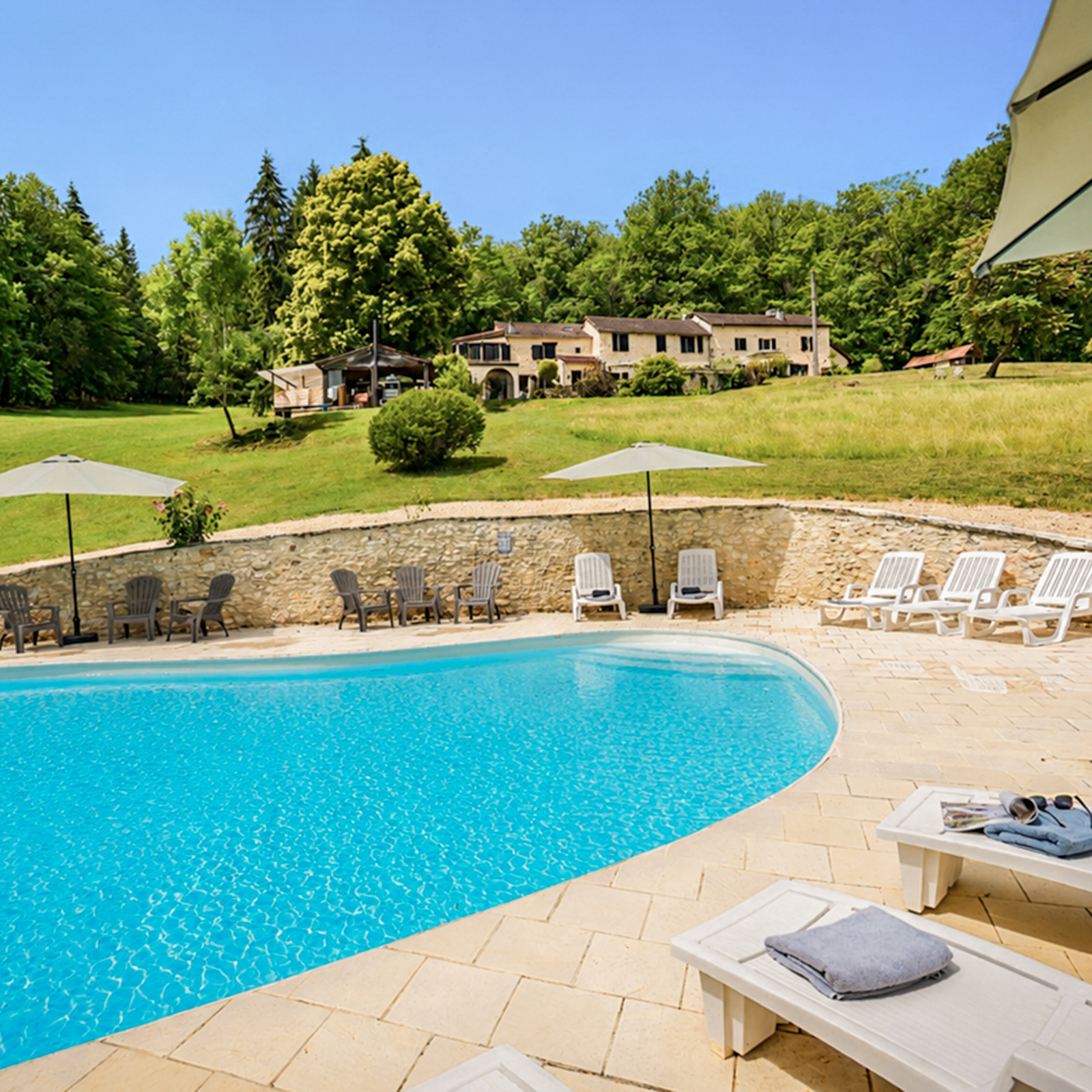 From the pool looking up to Beau Foret, also known as Font Neuve holiday villas near Souillac, Dordogne Valley, France