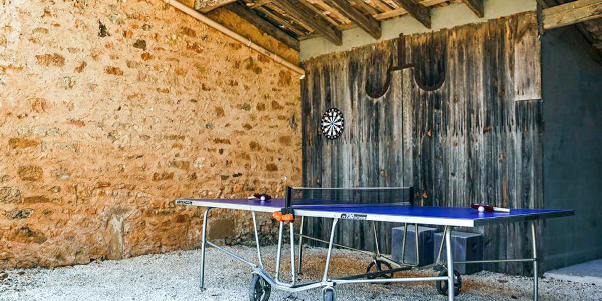 Games barn, covered shaded pétanque court and table tennis area