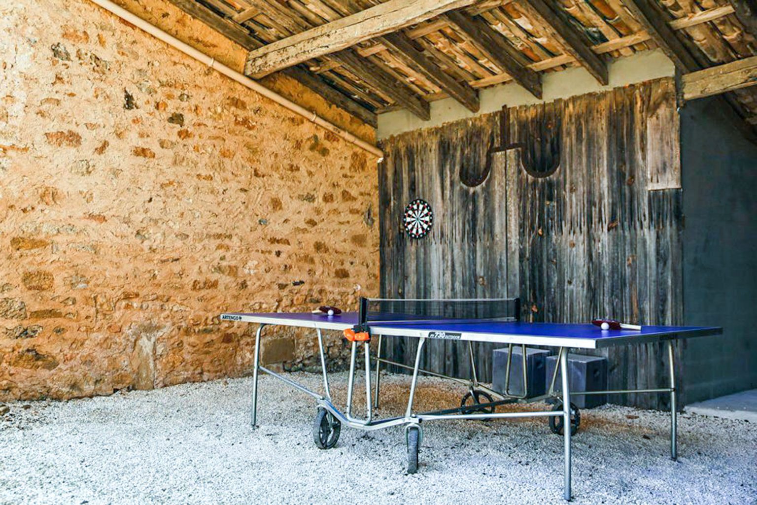 Games barn, covered shaded pétanque court and table tennis area