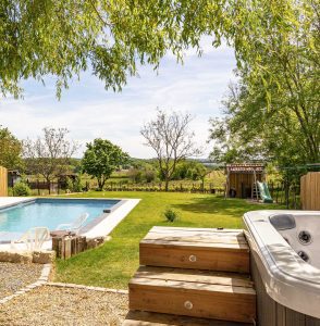 Hot tub and a heated pool with vineyard views