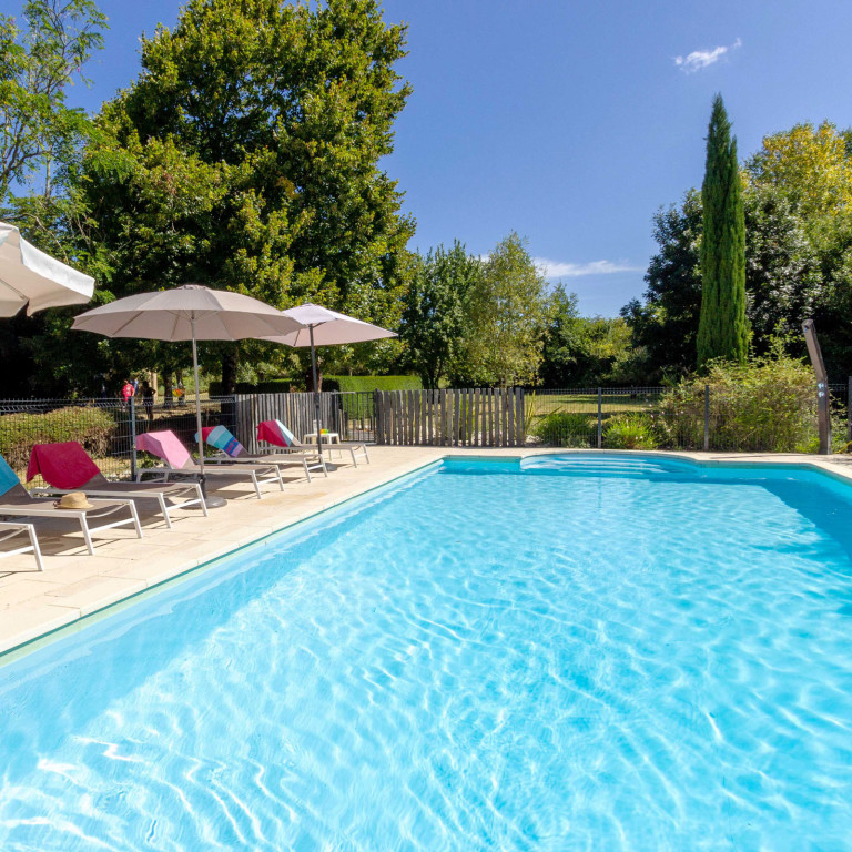 Secure gated swimming pool at Le Verger holiday villa near Eymet, southwest France