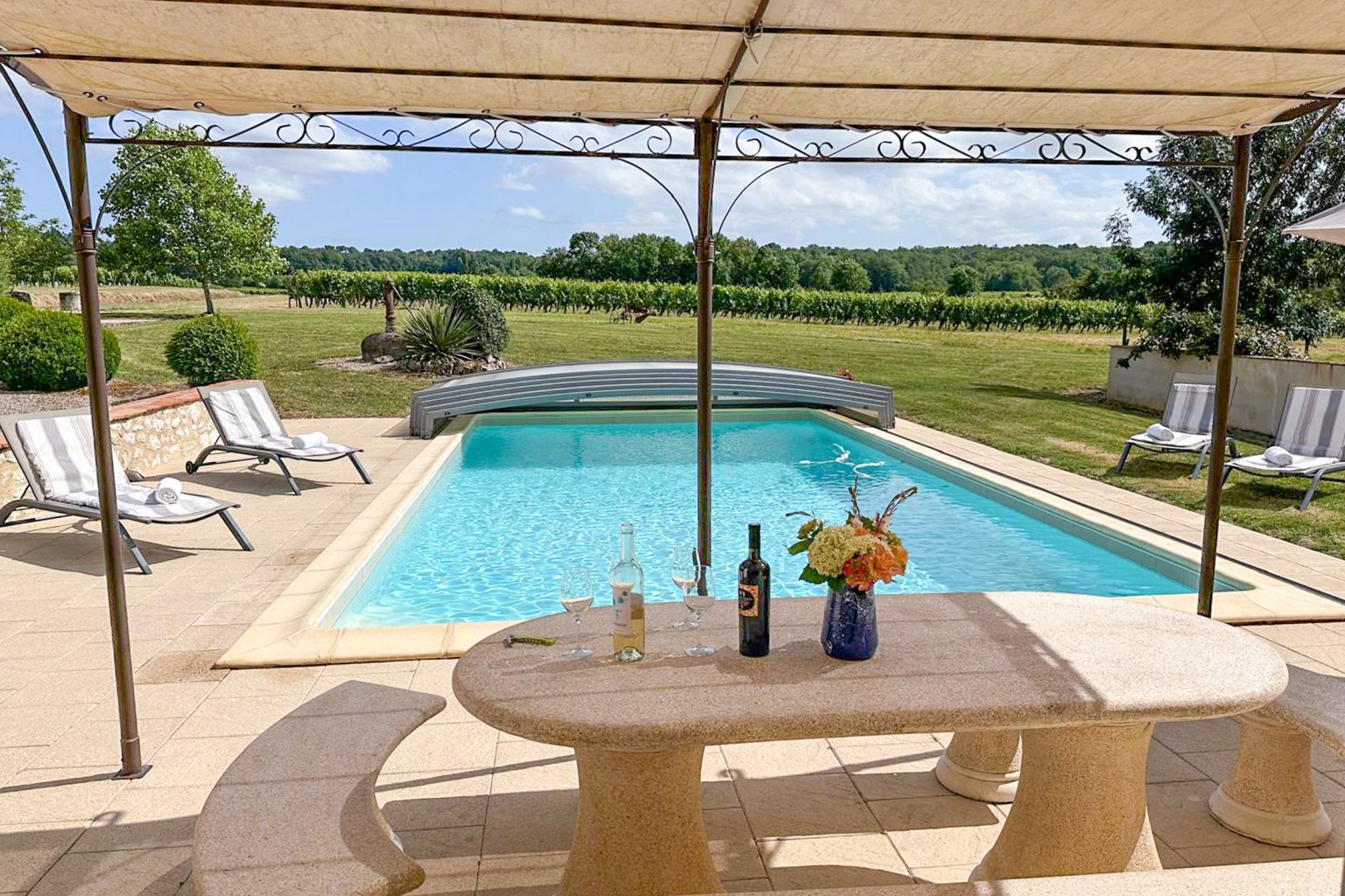 Shaded seating by the pool at Jubin, 5 bedroom villa with a secure private pool