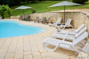 Sitting by the pool at Beau Foret, Font Neuve near Souillac, Dordogne Valley, France