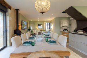 The 2 doors at the far end to the right, one is the utility room with a washing machine and a dryer, the other door is a WC