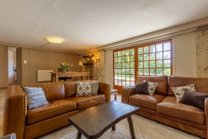 The TV lounge, a desk, the open door is bedroom 3