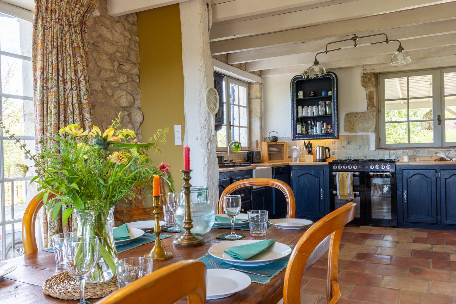 The dining room looking into the kitchen, the driveway is to the left