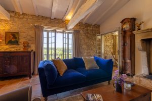 The sitting room, with wonderful far reaching views, the dining room is to the right