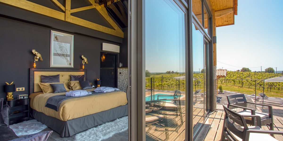 Walk out from the bedroom onto the terrace for views of the neighbouring vineyard